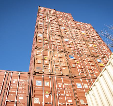 Stack of red drayage containers